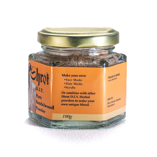 Jar of Shrot Pure Chandan Powder with gold lid on a white background. Side view.