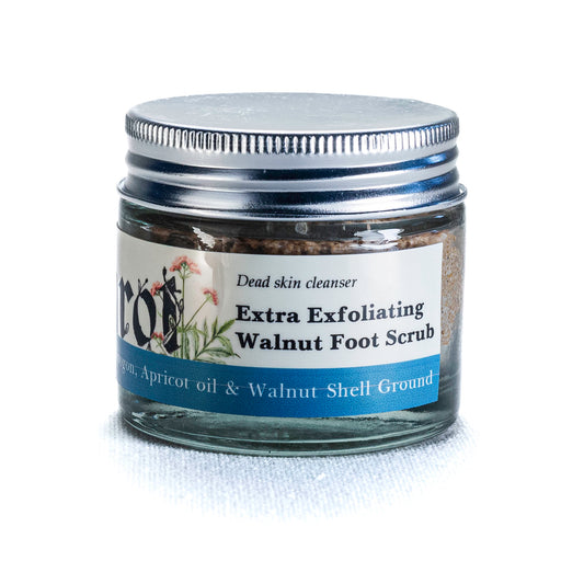 Jar of Shrot Walnut Foot Scrub with a label on a white background. Side angle.