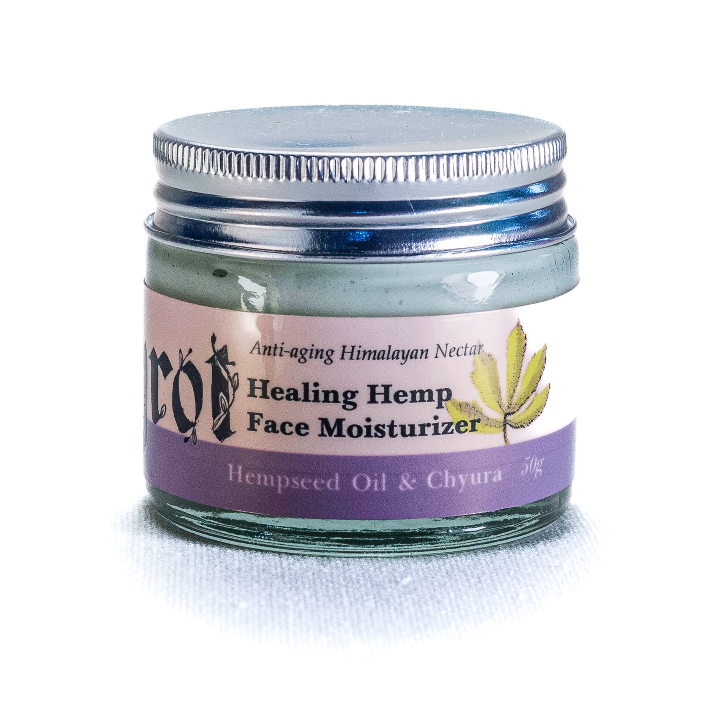 Healing Hemp Face Moisturizer jar with purple label on a white background. Side angle.