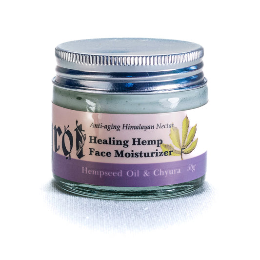 Healing Hemp Face Moisturizer jar with purple label on a white background. Side angle.