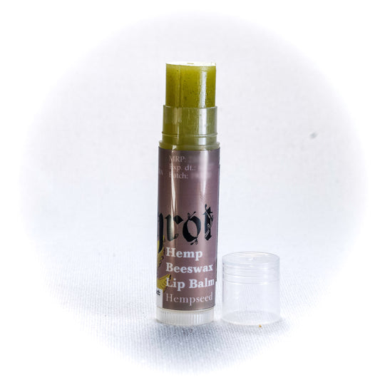 Hemp Beeswax Lip Balm by Shrot on a white background. Side angle.