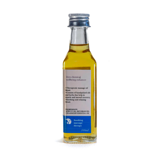 Bottle of Shrot Apricot massage oil with label on a white background. Side view.