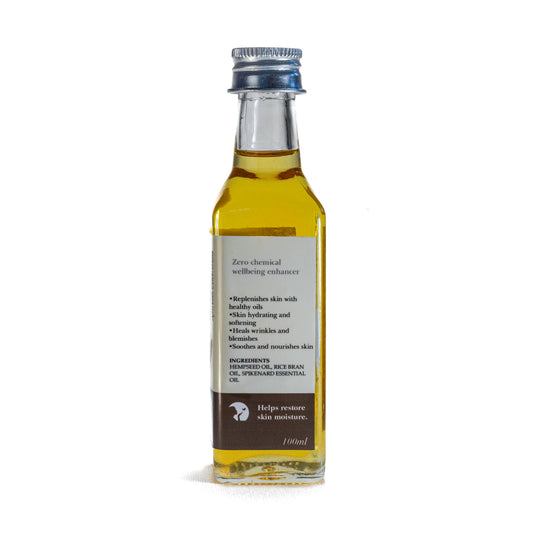 Bottle of Shrot Body oil with label on a white background. Side angle.