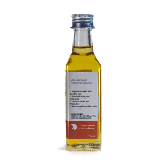 Bottle of Shrot Body oil with label on a white background. Side angle.