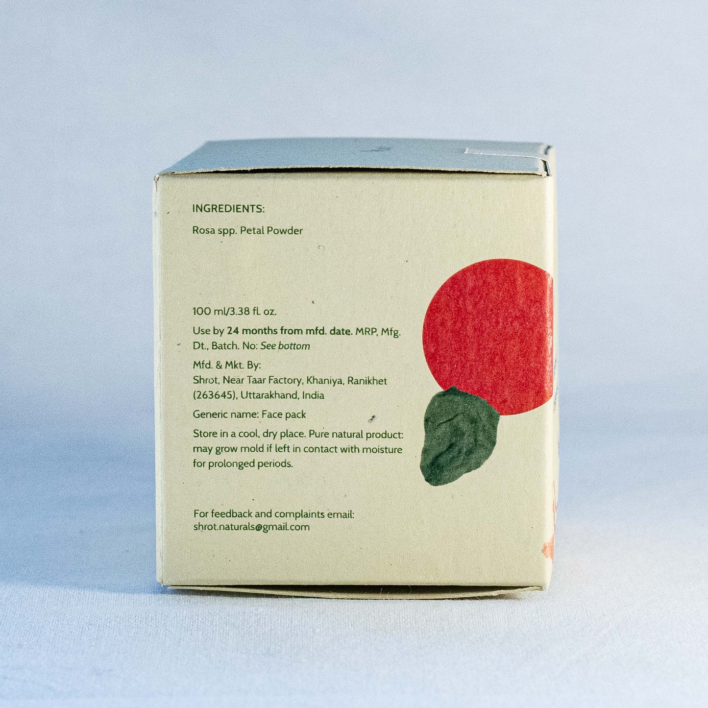 Back of a skincare product box by Shrot natural skincare with ingredient list and branding on a light blue background