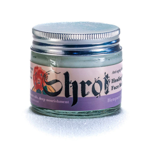 Jar of Shrot face cream with a silver lid on a white background. Front angle.