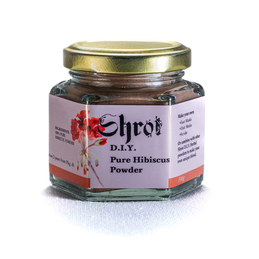 Jar of Shrot Pure Hibiscus Powder with a gold lid on a white background. Front angle.
