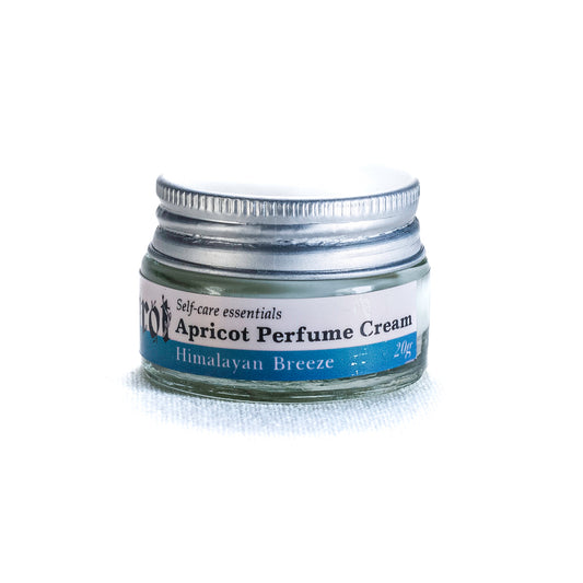 Jar of Shrot Apricot Perfume Cream with a white background, side angle.
