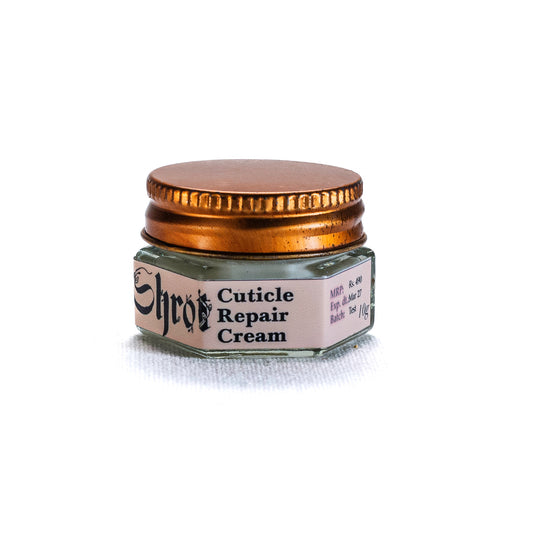 Jar of cuticle repair cream by Shrot with a gold lid on a white background. Side angle.