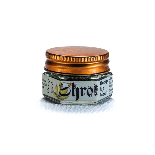 Small hexagonal jar of Lip scrub by Shrot with a gold lid on a white background