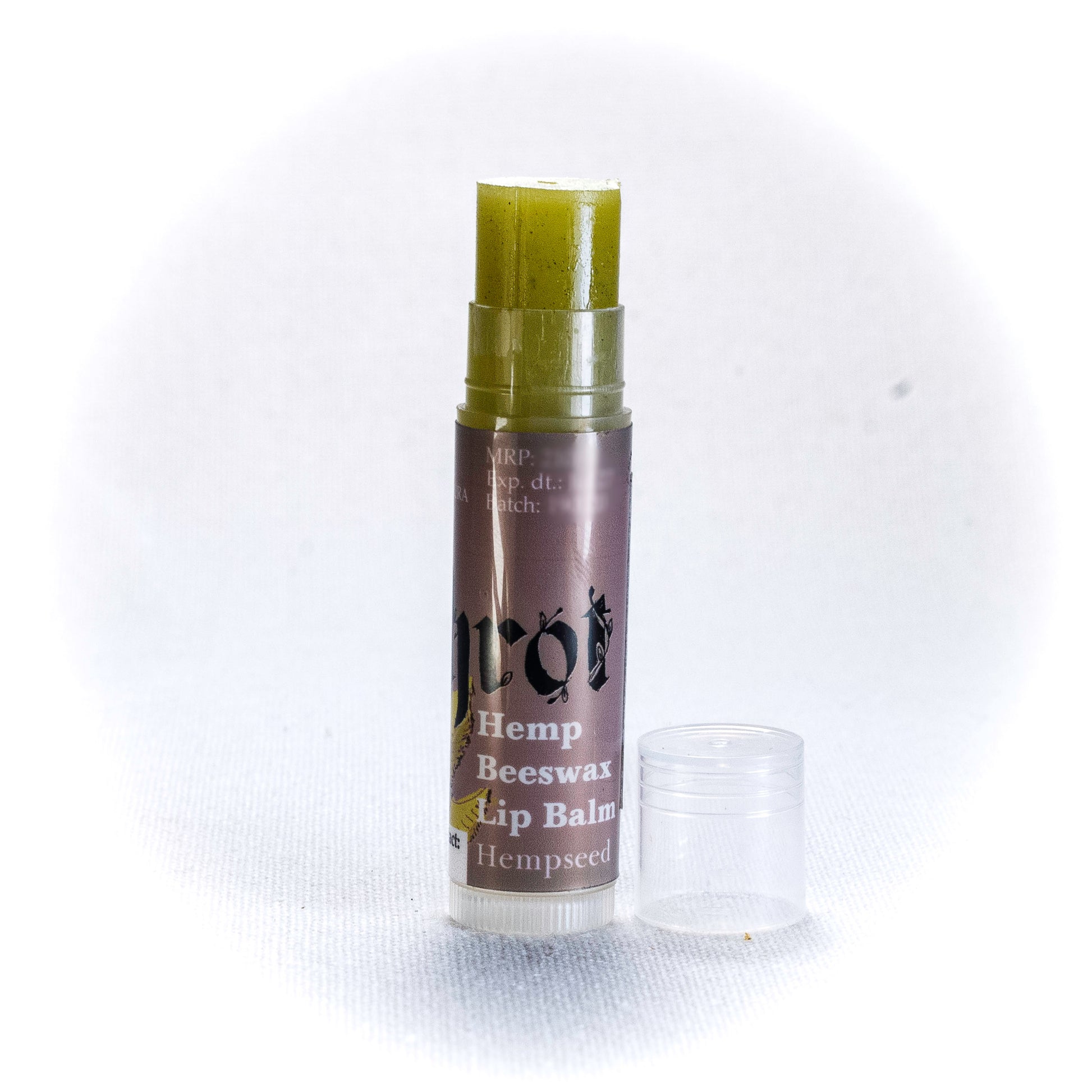 Hemp Beeswax Lip Balm by Shrot on a white background. Side angle.