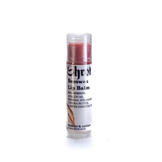 Tinted Lip balm stick by Shrot on a white background. Front angle.