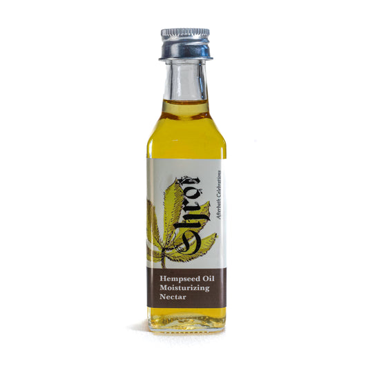 Bottle of Shrot hempseed Moisturizing oil with a label on a white background. Front angle.