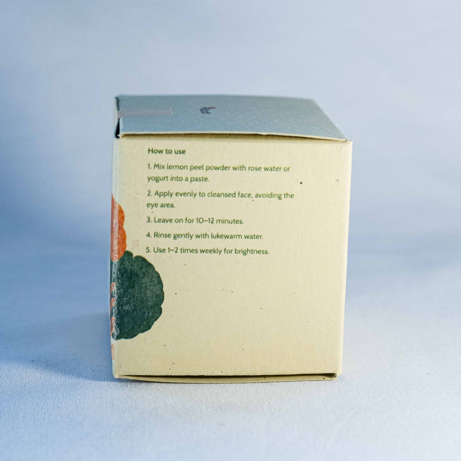 Box with instructions by Shrot natural cosmetics on a light blue background