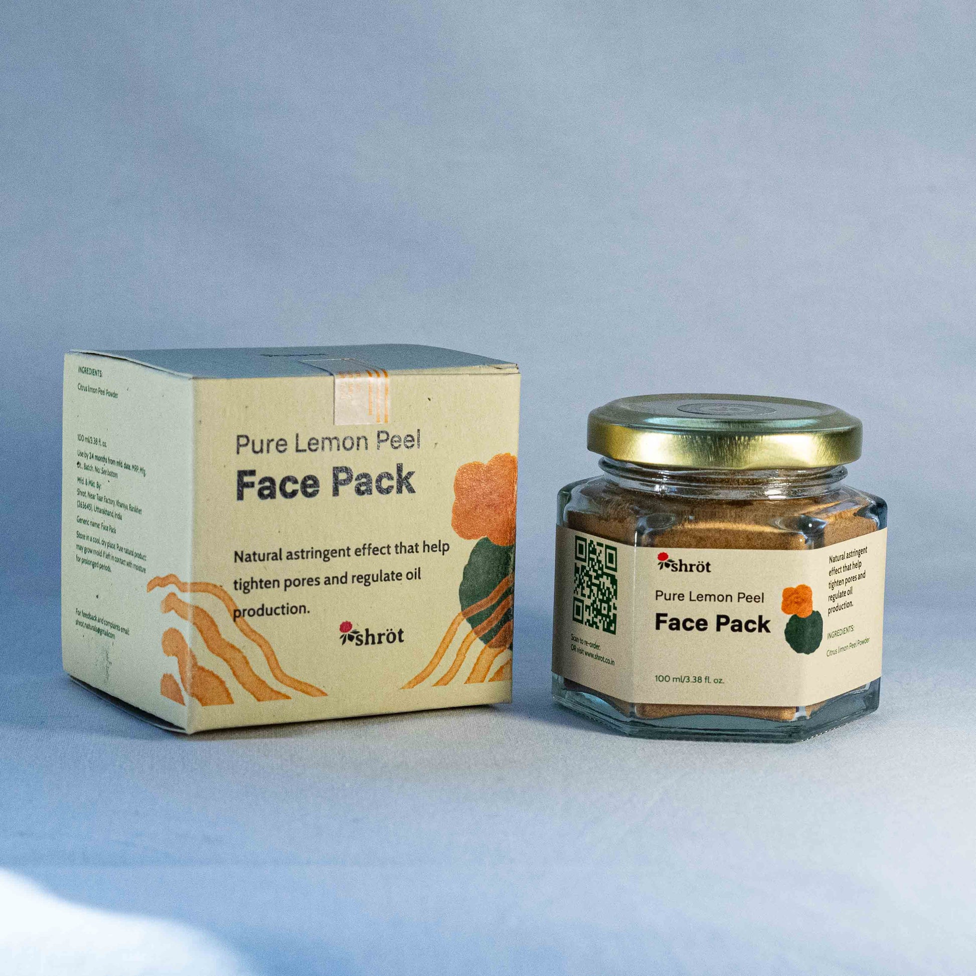 Jar of Shrot Pure Lemon Peel Face Pack and its packaging on a light blue background