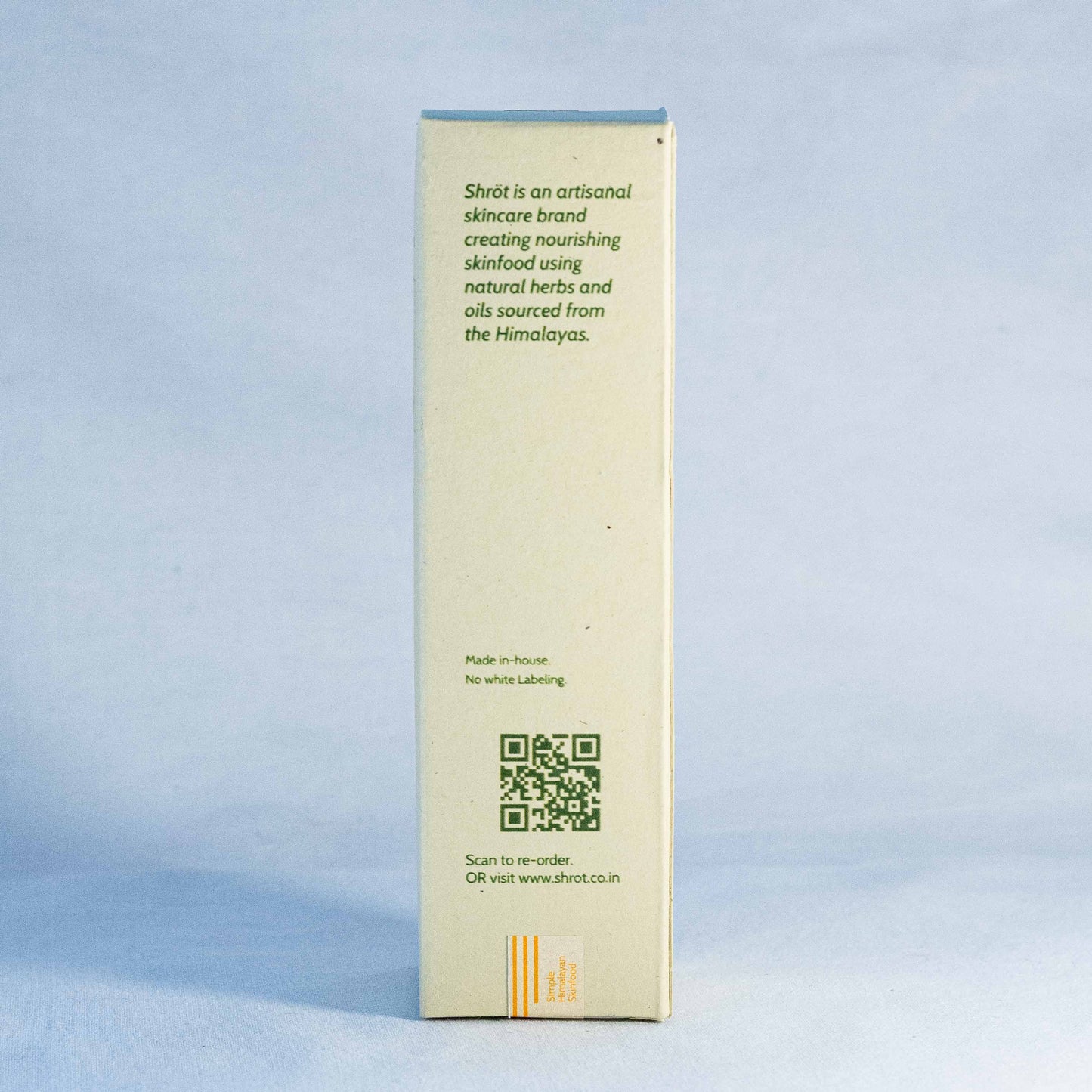 Product packaging with text and QR code by a natural skincare brand called Shrot on a light blue background