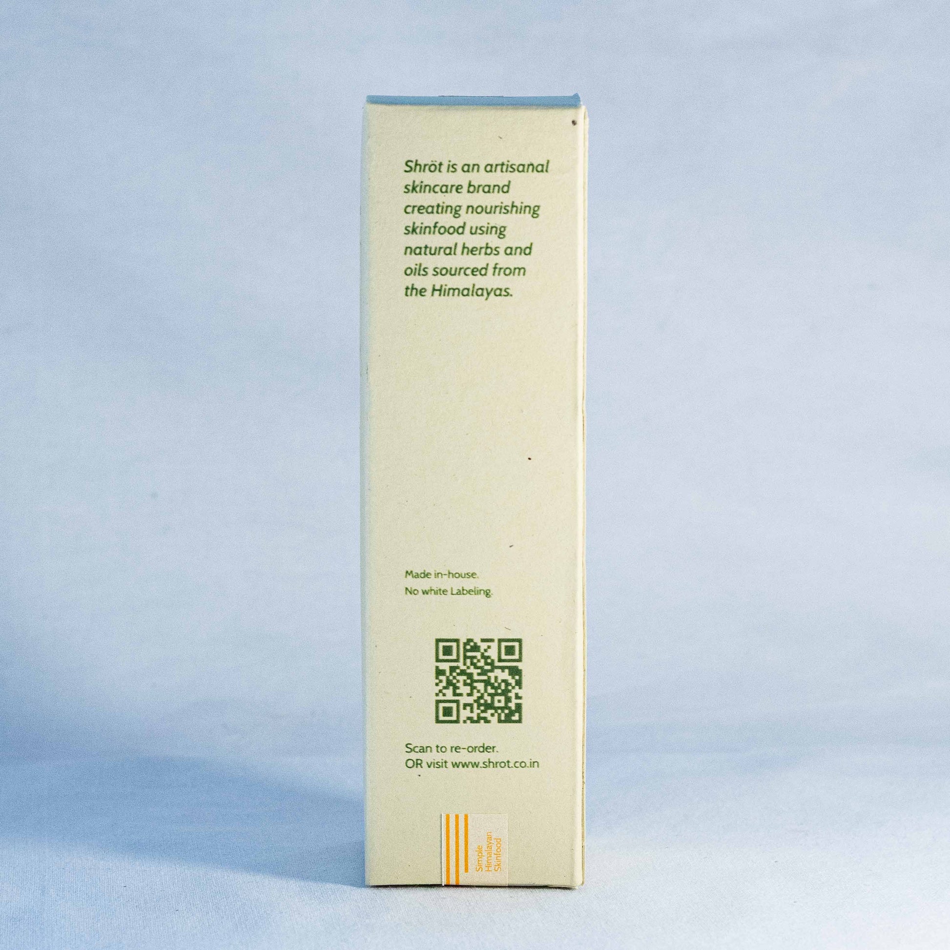 Product packaging with text and QR code by a natural skincare brand called Shrot on a light blue background