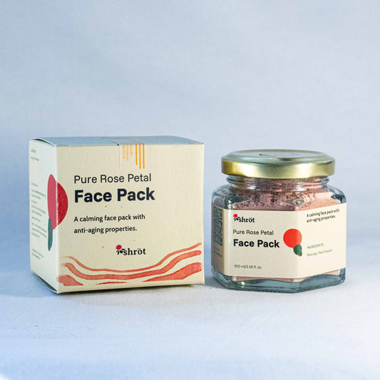 Jar of Shrot pure rose petal face pack with packaging on a light gray background