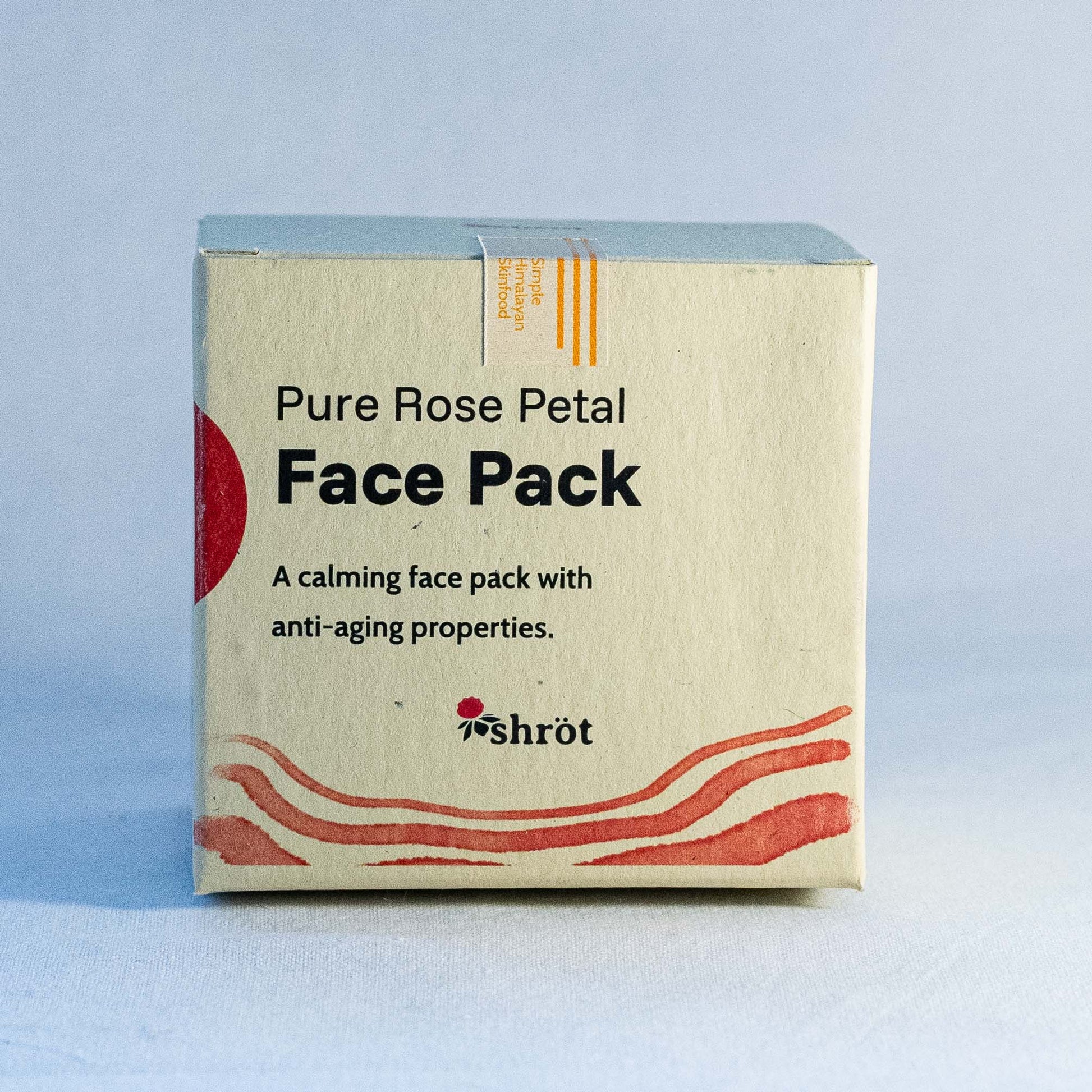 Box of Shrot Pure Rose Petal Face Pack with branding on a light blue background