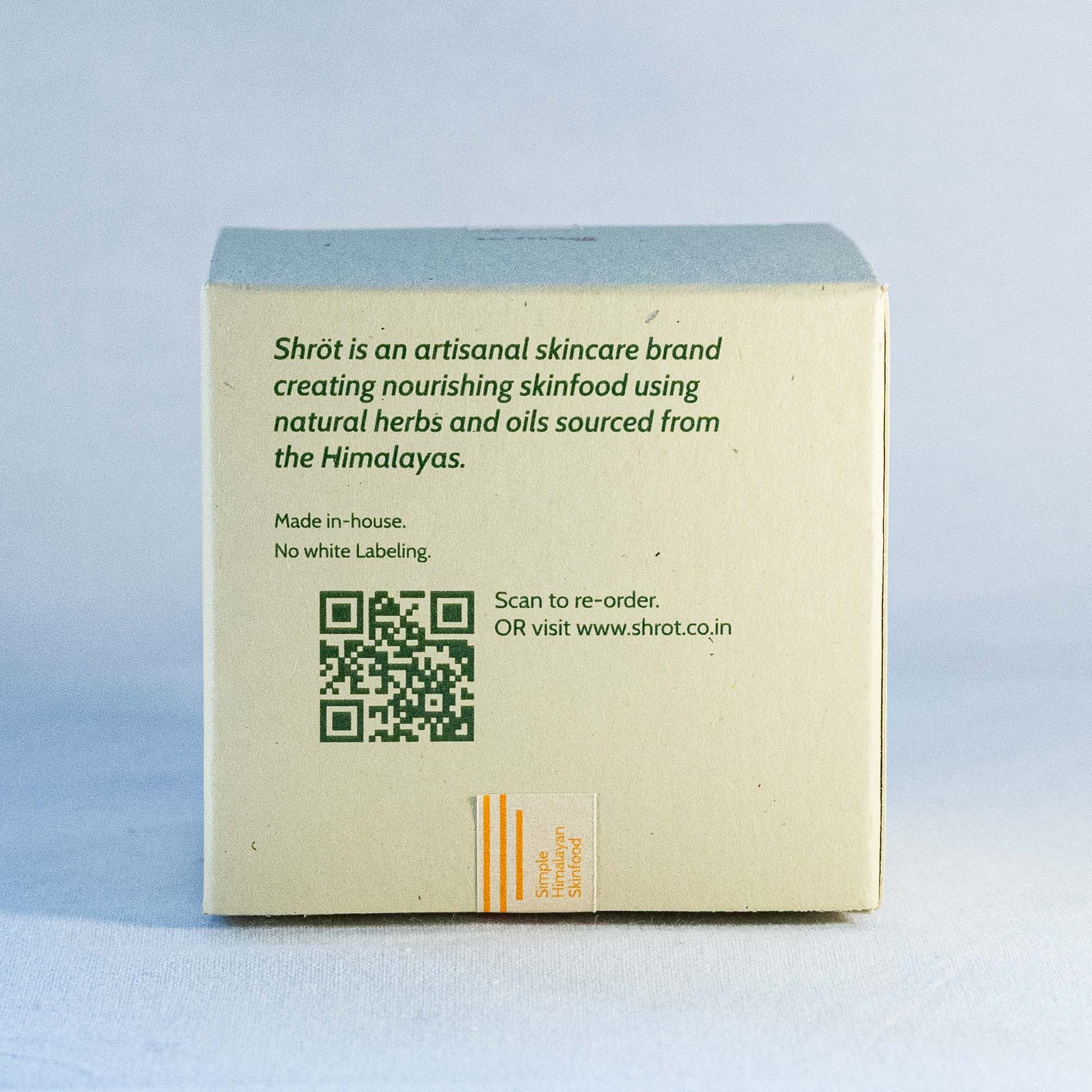 Luxury skincare product packaging by Shrot natural skincare with brand information on a light blue background