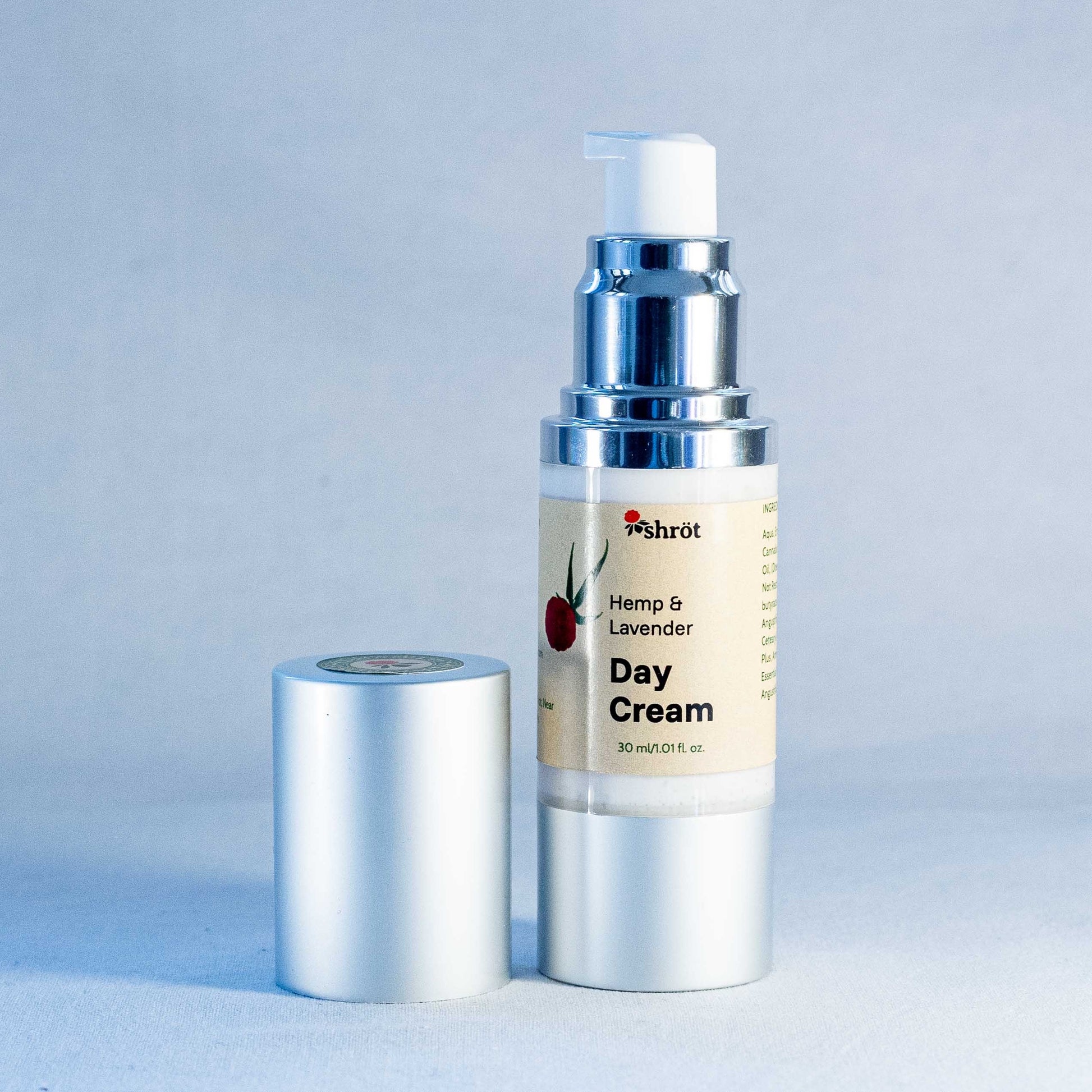 Day cream bottle with pump and label on a light gray background by a trending Indian skincare brand called Shrot