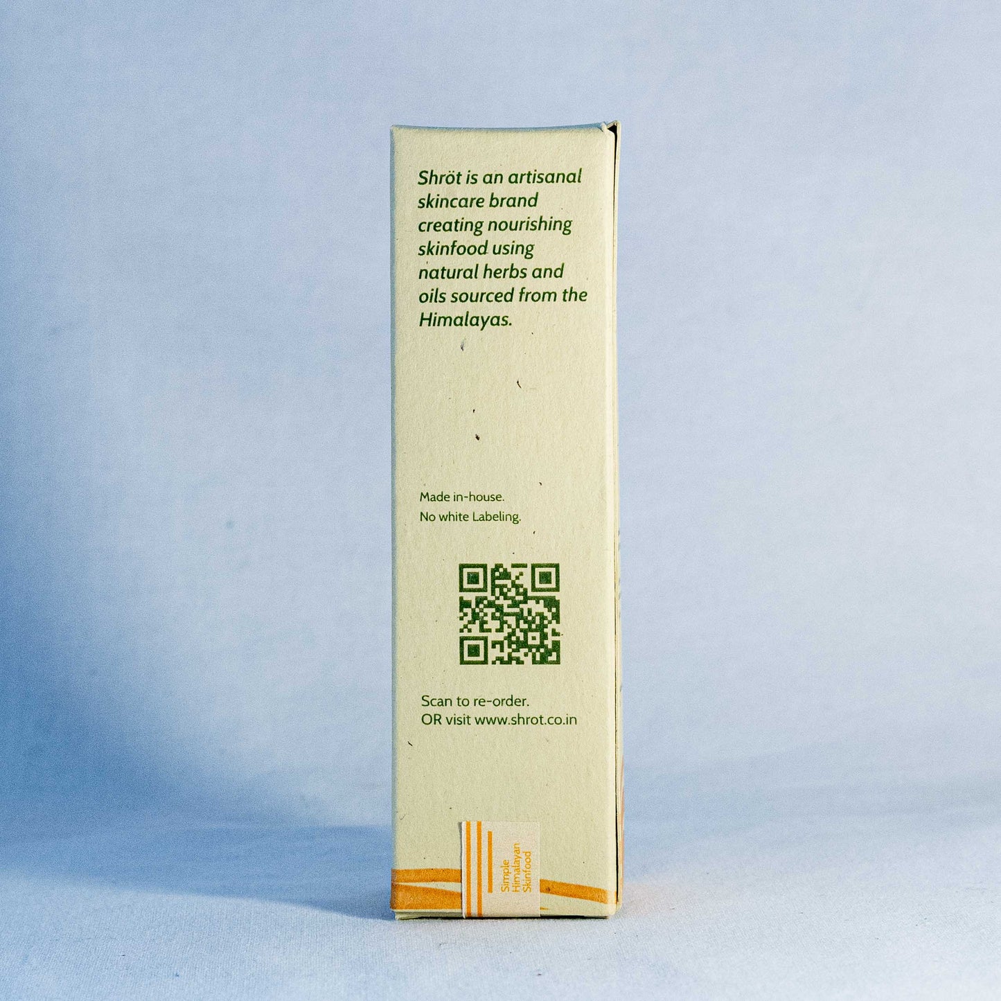 Shot skincare product box with branding and QR code on a light blue background by a trending Indian skincare brand called Shrot