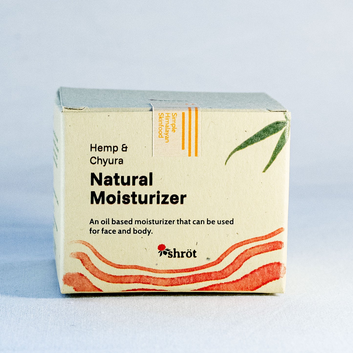 Box of Hemp & Chyura Natural Moisturizer by a natural skincare brand called Shrot on a light blue background