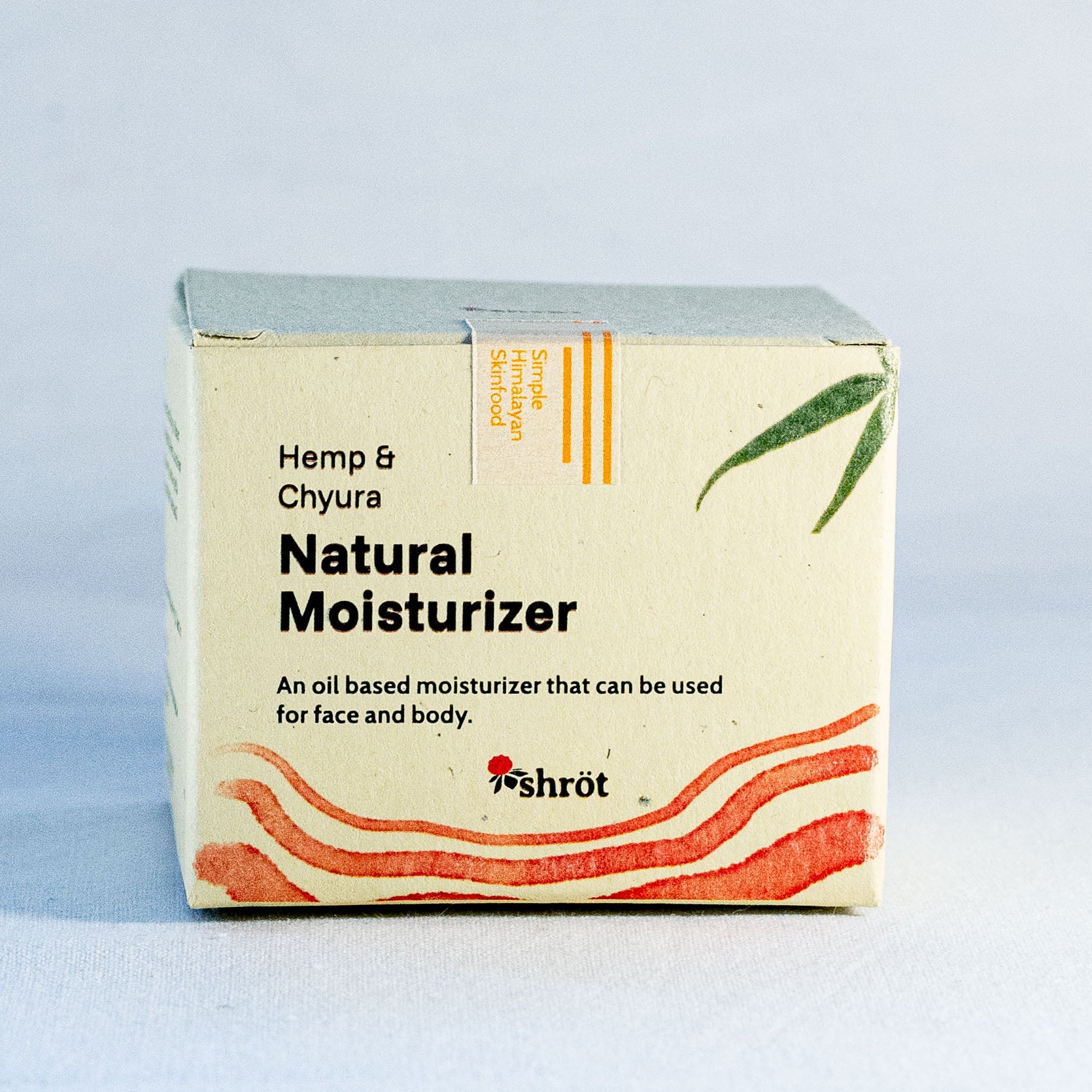 Box of Hemp & Chyura Natural Moisturizer by a natural skincare brand called Shrot on a light blue background