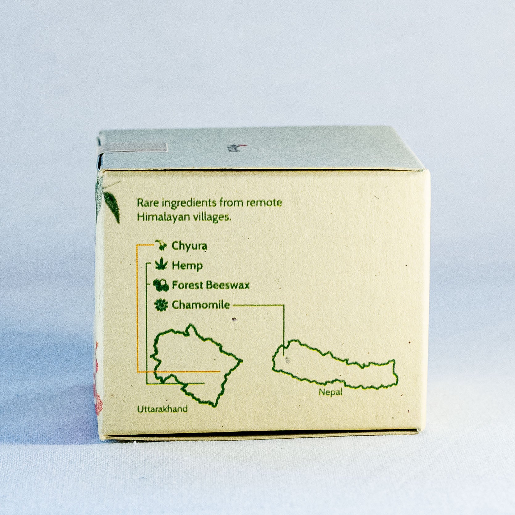 Box with Himalayan village ingredients text on a light blue background by a natural skincare brand called Shrot