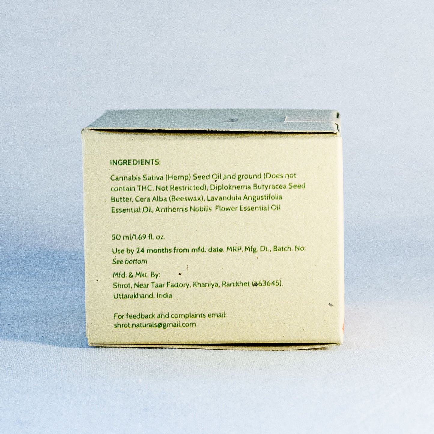 Box with ingredient list on a light blue background by a natural skincare brand called Shrot