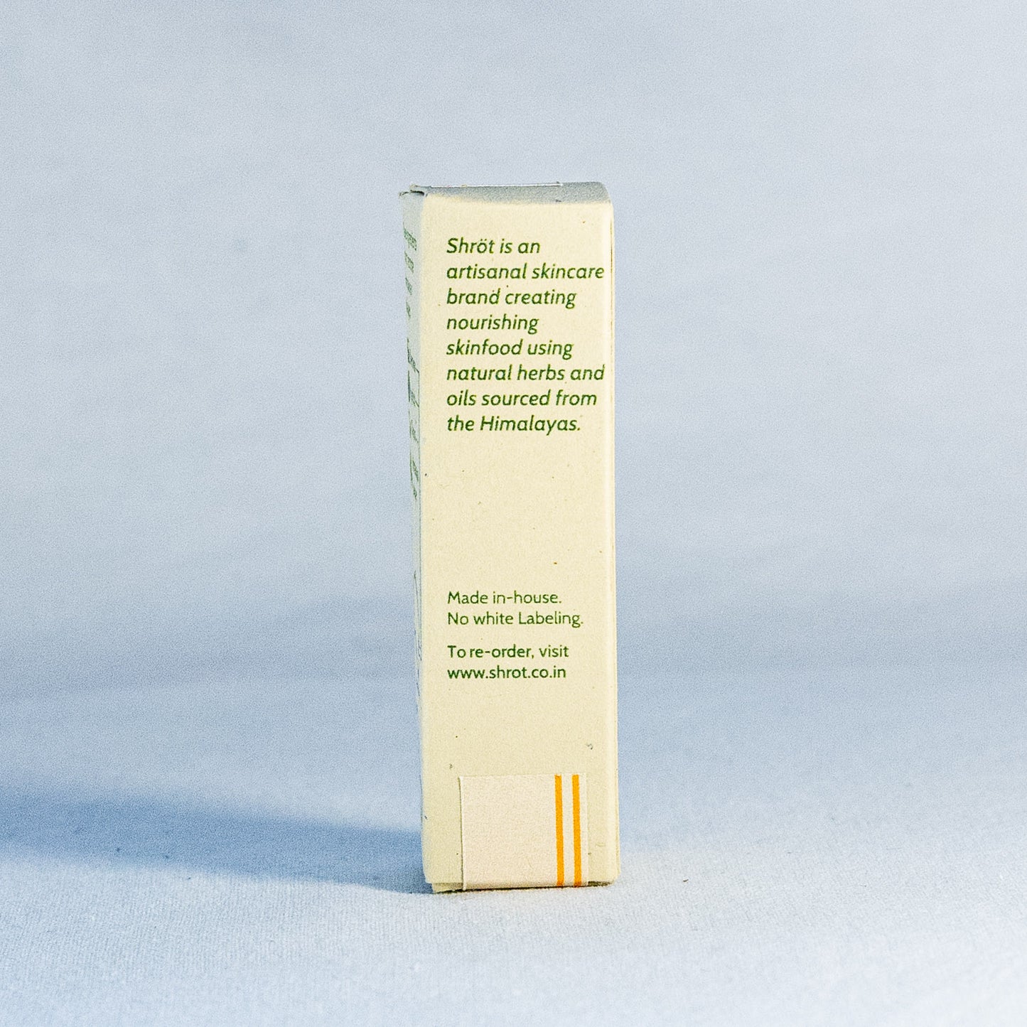 Shot skincare product packaging by a natural skincare brand called Shrot on a light blue background