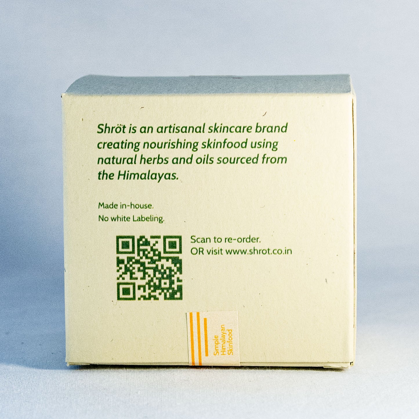 Box with Shrot skincare brand information and QR code on a light gray background