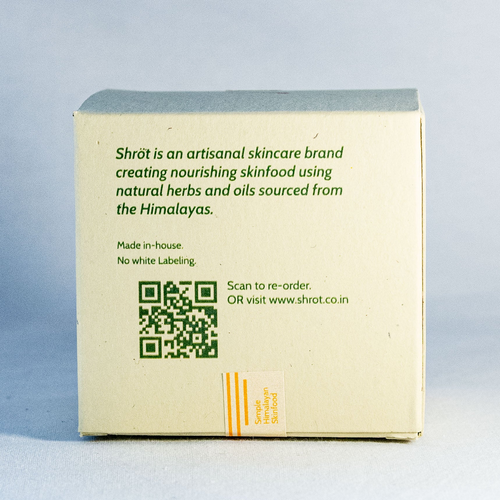 Box with Shrot skincare brand information and QR code on a light gray background