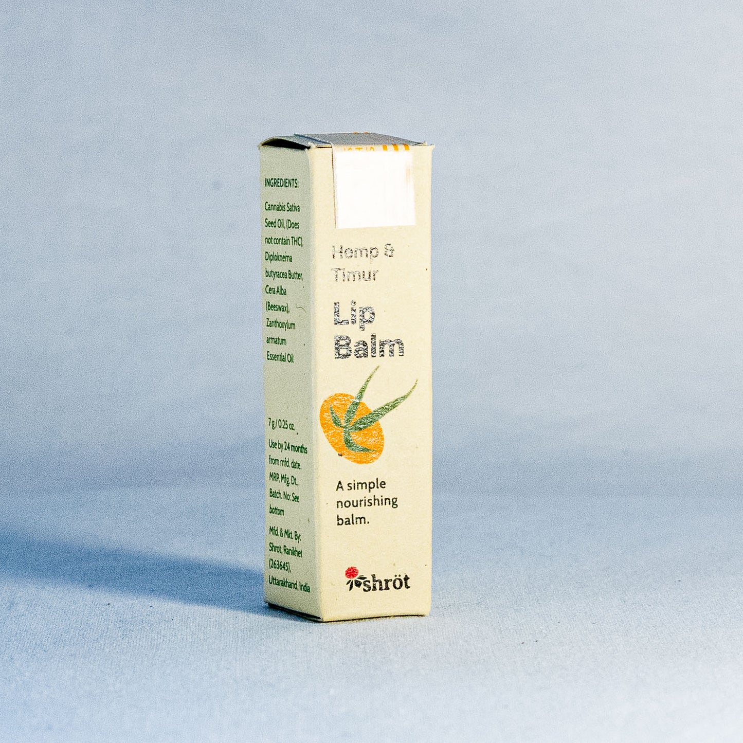 Lip balm box with Hemp illustration on a light gray background by a natural skincare brand called Shrot.