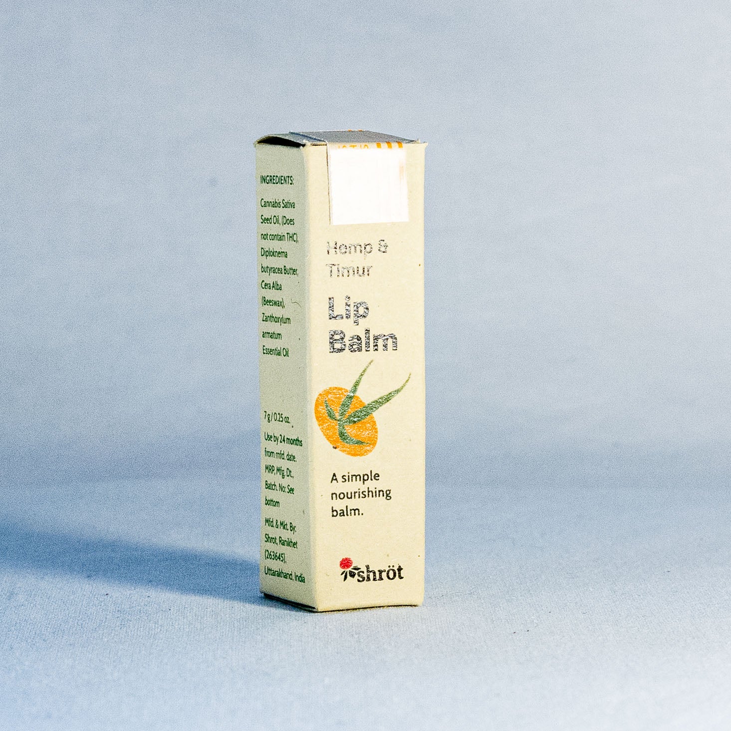 Lip balm box with Hemp illustration on a light gray background by a natural skincare brand called Shrot.