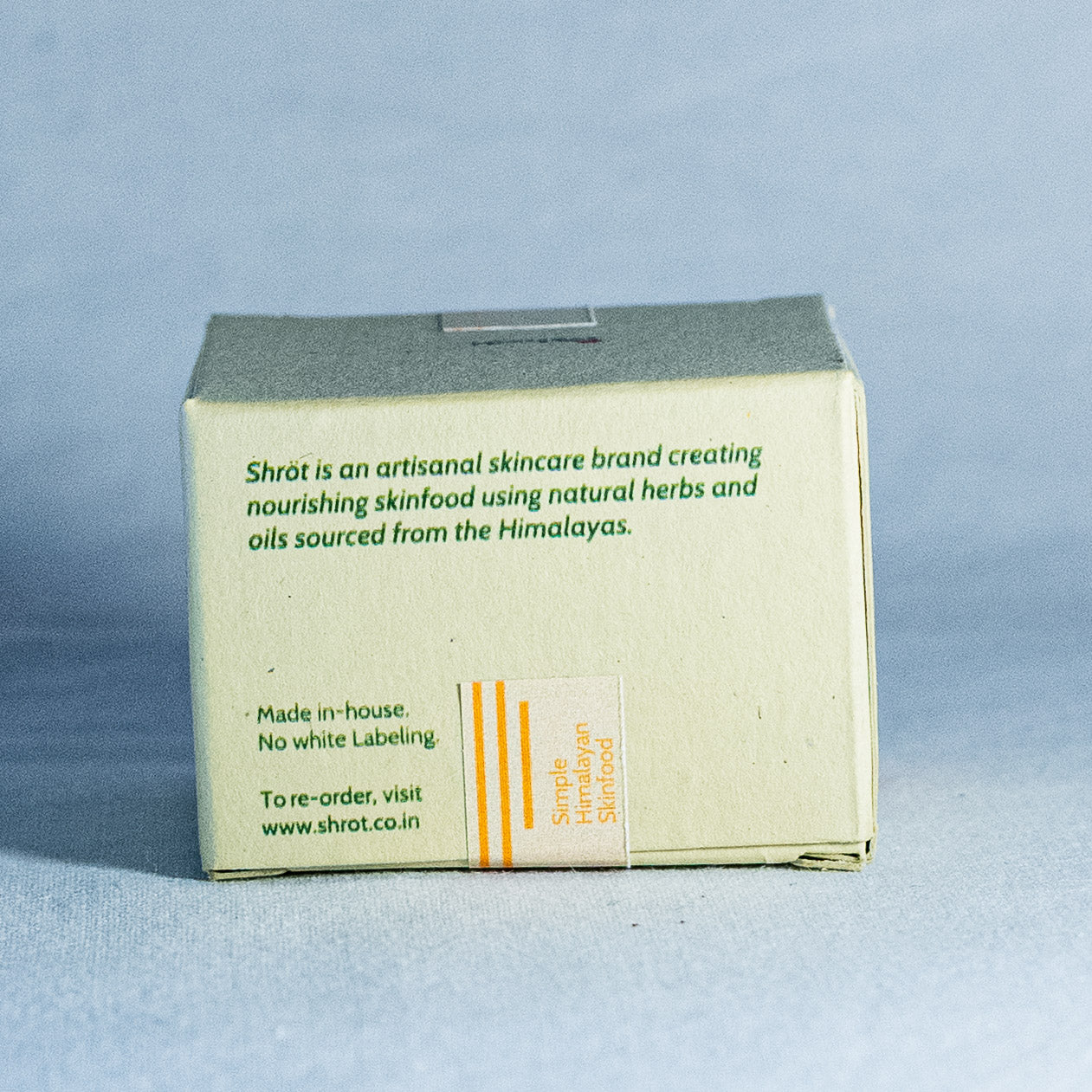 Shrot natural skincare brand box on a light blue background