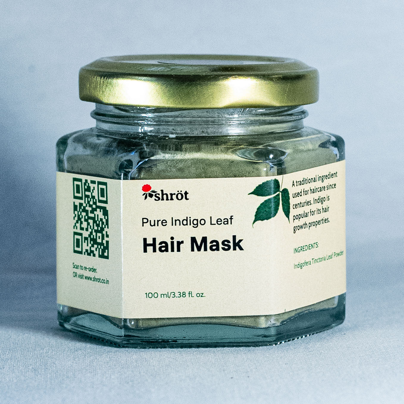 Jar of Shrot Pure Indigo Leaf Hair Mask with a gold lid on a gray background