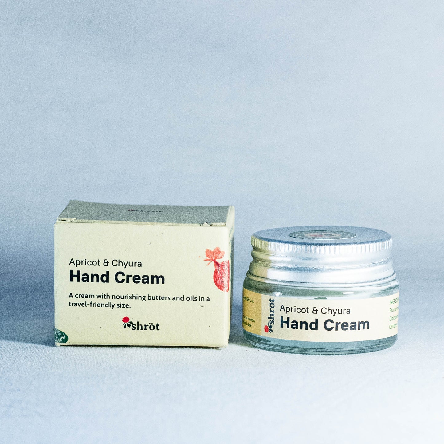 Hand cream jar and box with 'Shrot' branding on a light gray background by a natural skincare brand called Shrot