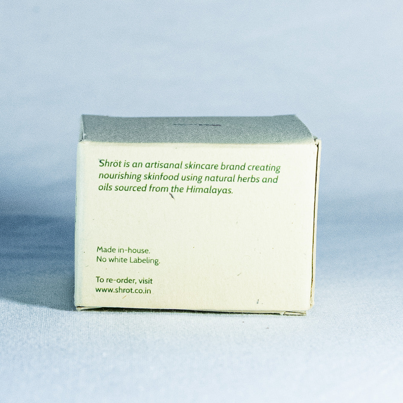 Skincare product packaging with branding text on a light gray background by a trending Indian skincare brand called Shrot 