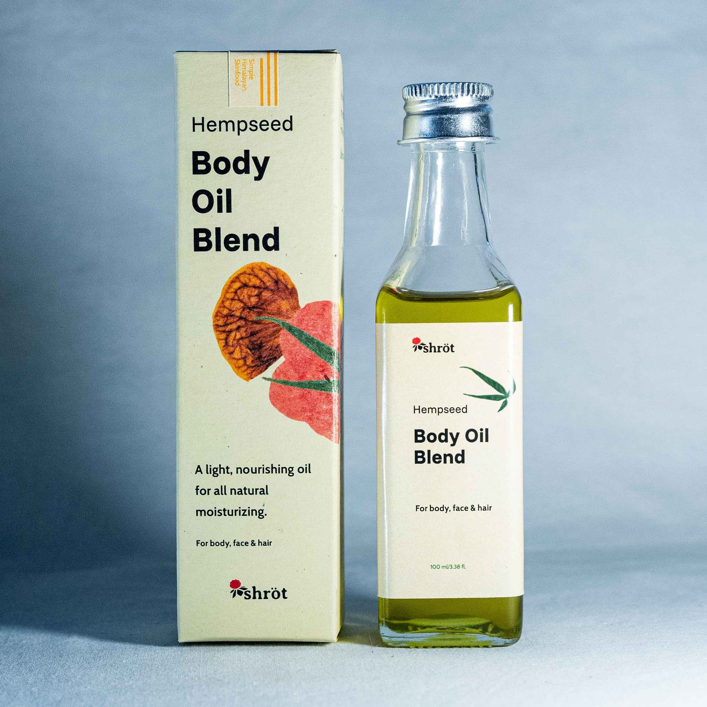 Hempseed Body Oil Blend bottle and packaging by a natural skincare brand called Shrot on a gray background