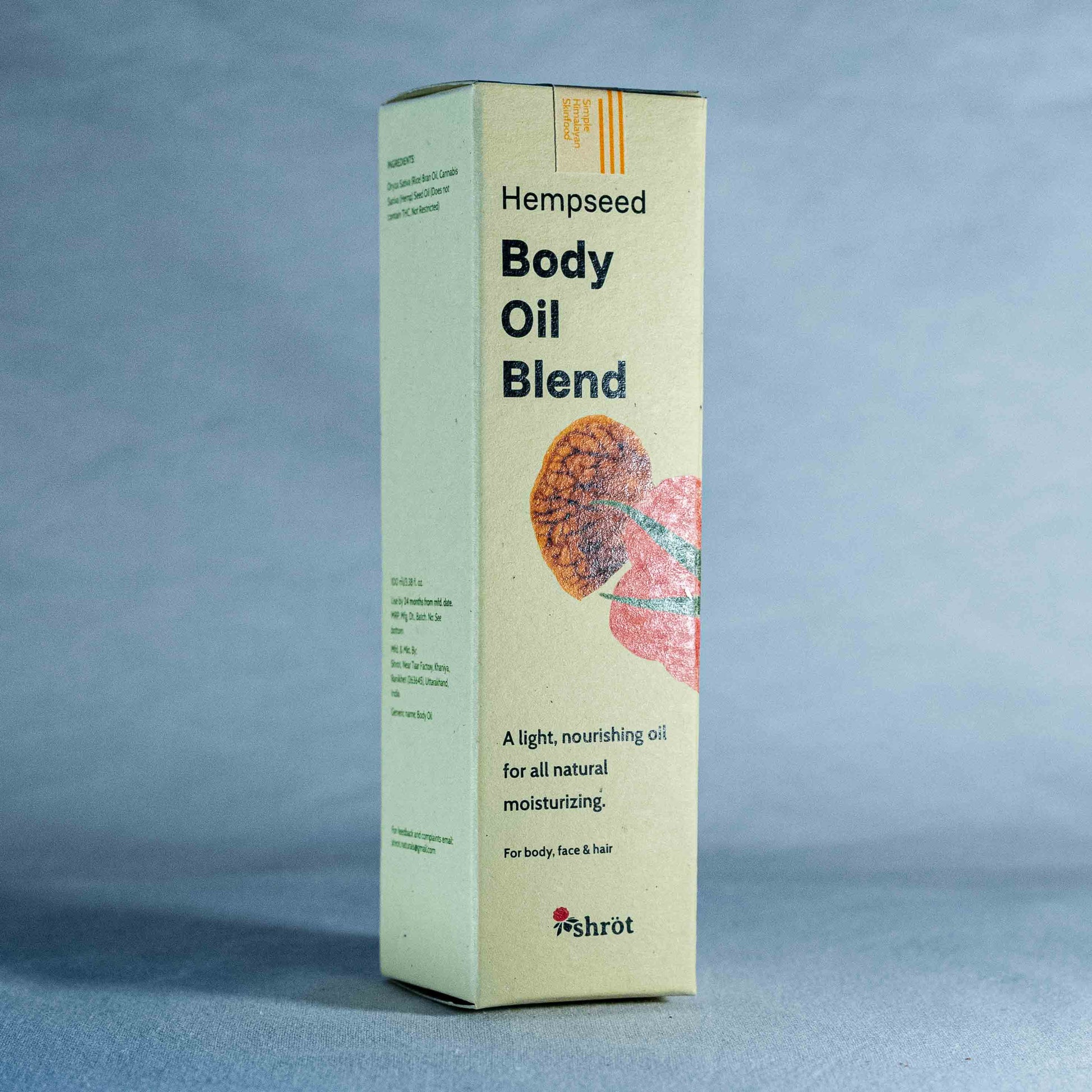 Box of Hempseed Body Oil Blend by a natural skincare brand called Shrot on a gray background