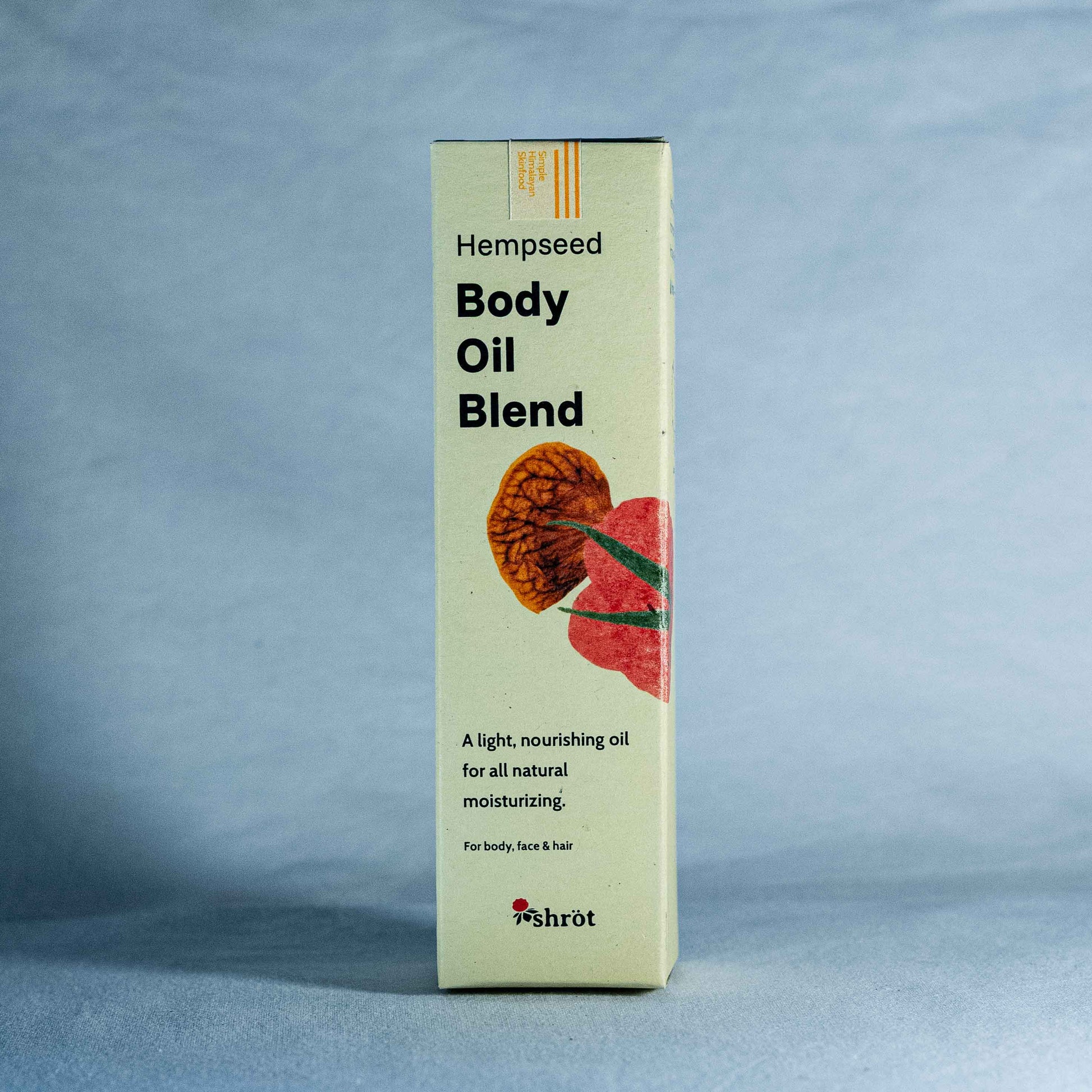 Box of Hempseed Body Oil Blend by a natural skincare brand called Shrot on a blue background