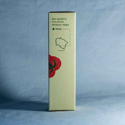 Tall rectangular box with a red floral illustration by a natural skincare brand called Shrot, and text on a gray background