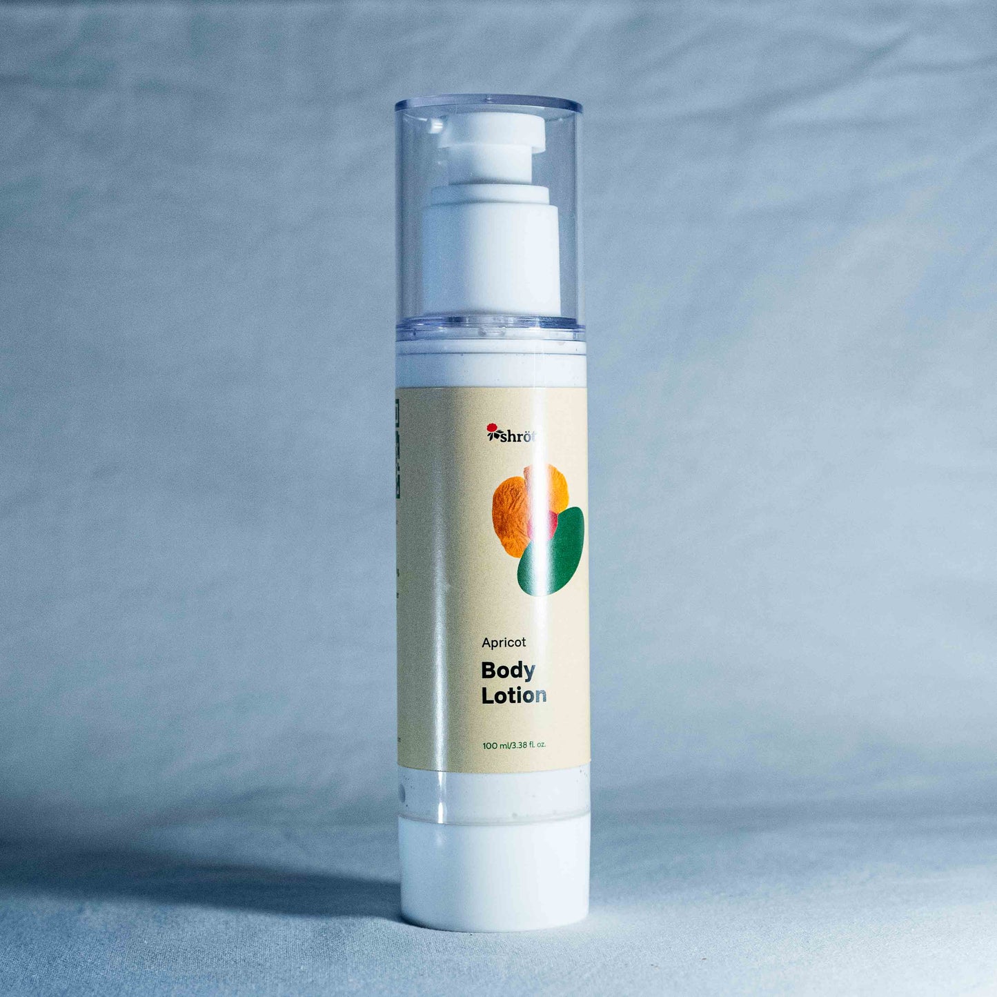 Body lotion bottle with a gray background by a trending Indian skincare brand called Shrot