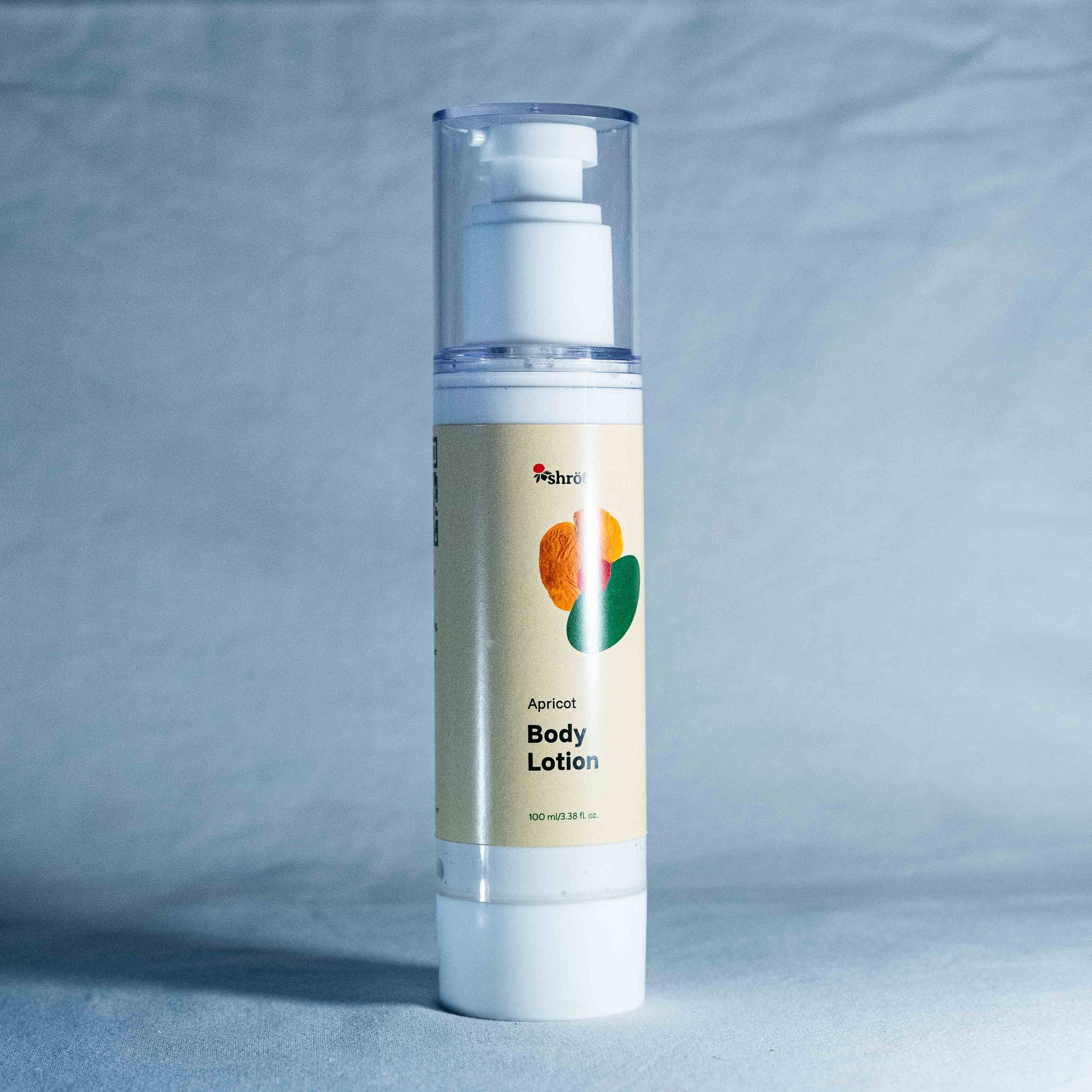 Body lotion bottle with a gray background by a trending Indian skincare brand called Shrot
