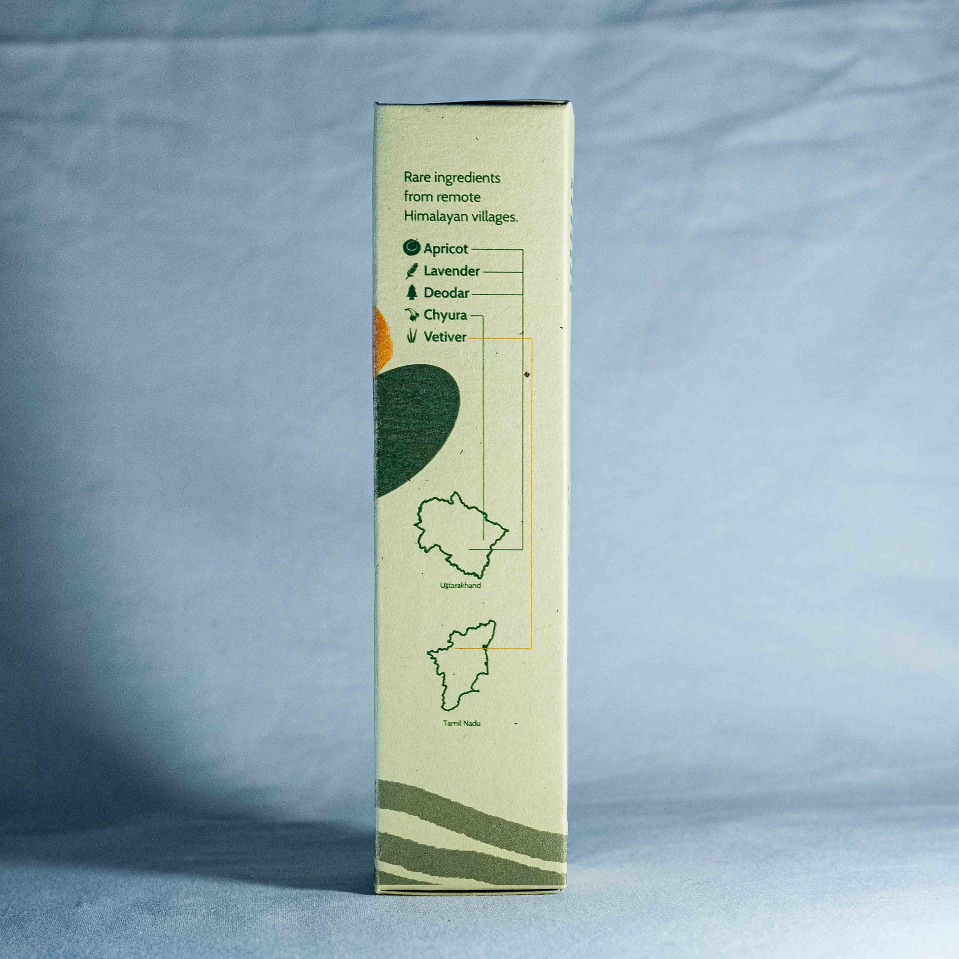 Tall rectangular box with green and white design on a blue background by a trending Indian skincare brand called Shrot