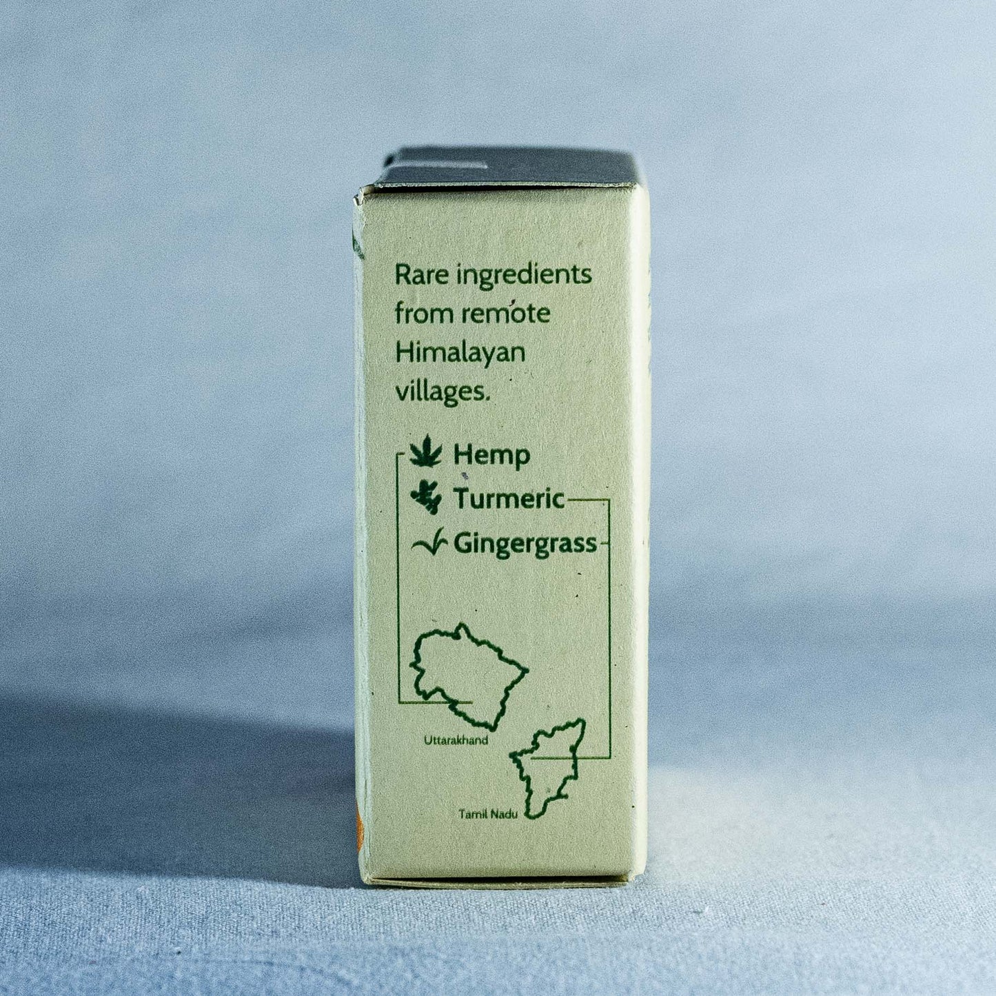 Box of Shrot soap with text about rare ingredients from remote Himalayan villages on a gray background