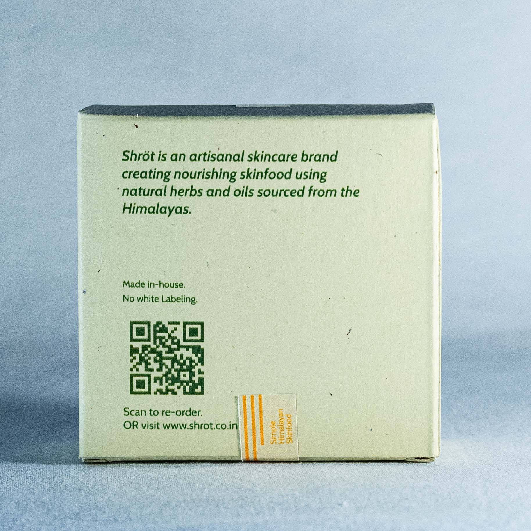 Shrot skincare brand box with text and QR code on a gray background