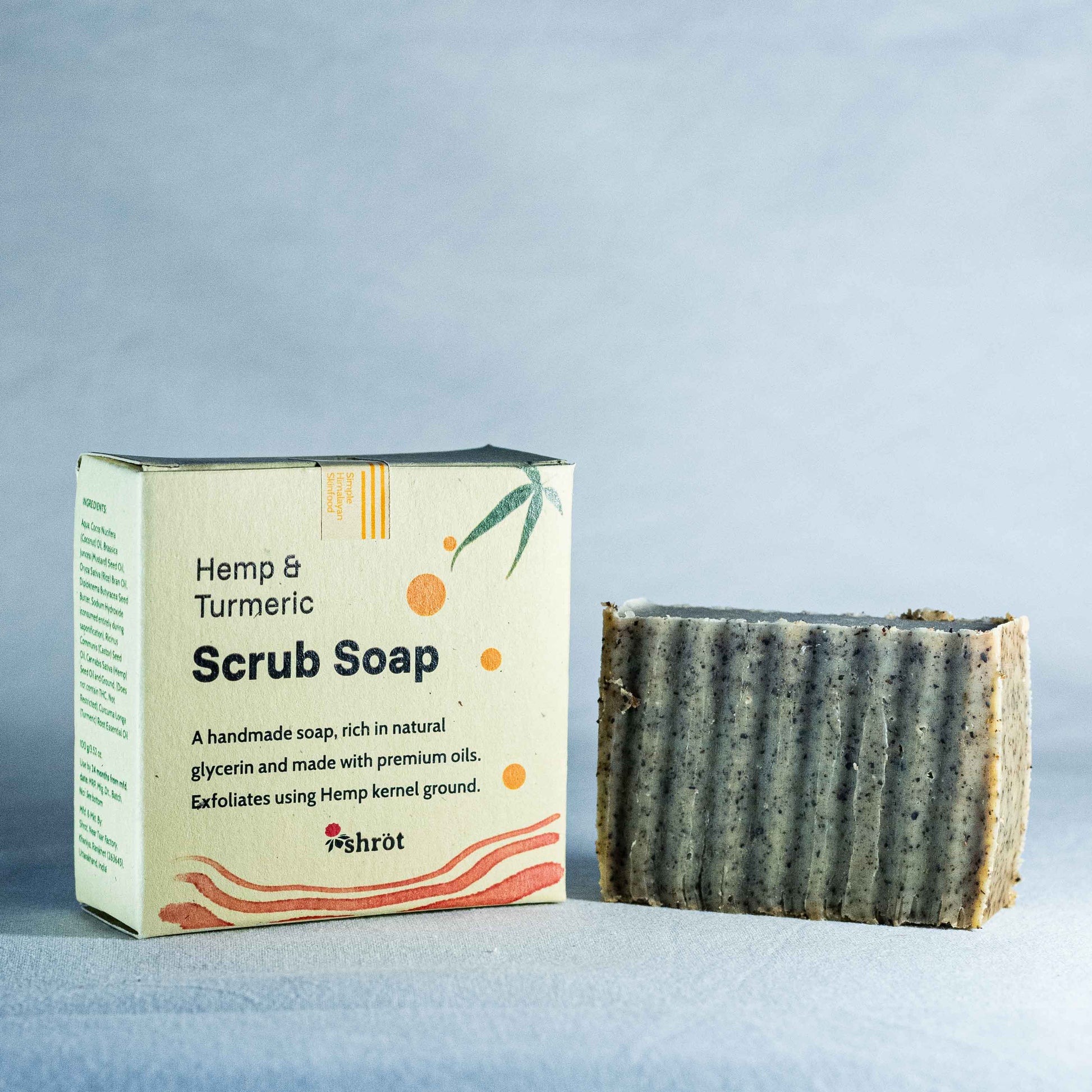 Hemp & Turmeric Natural Soap by Shrot with packaging on a light blue background