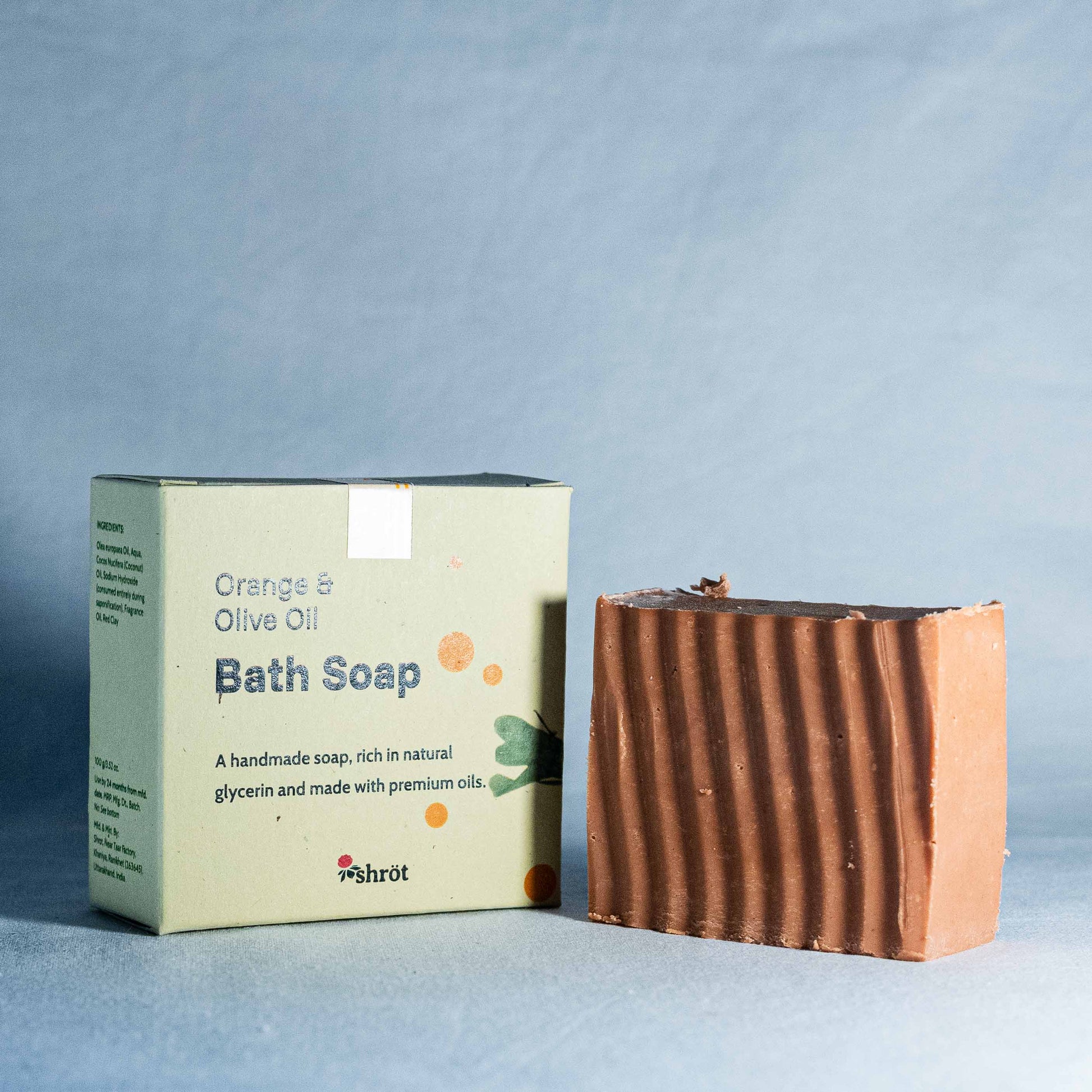 Bath soap bar and packaging on a light blue background